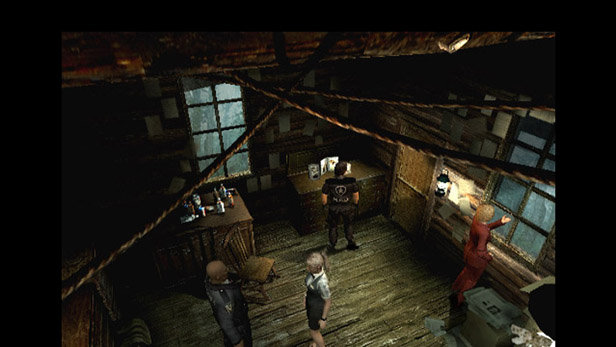 Image displays screenshot of Resident Evil Outbreak for PS2. Includes characters standing in a room.